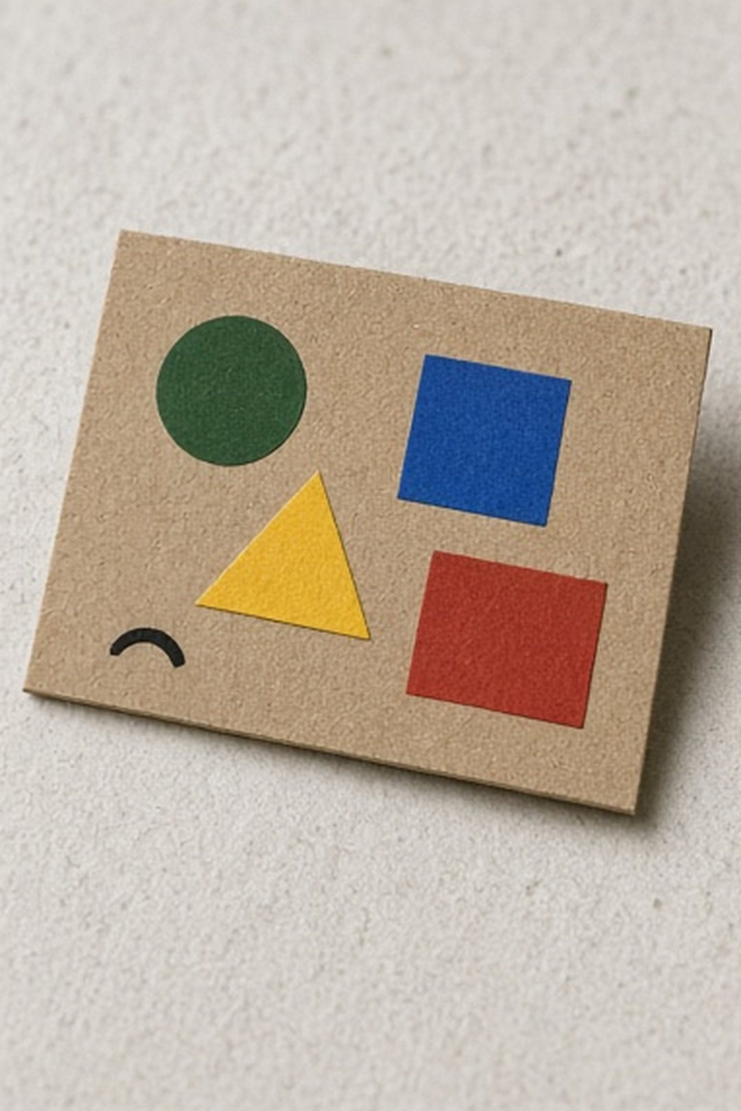 Small cardboard action card with four abstract colored selection marks